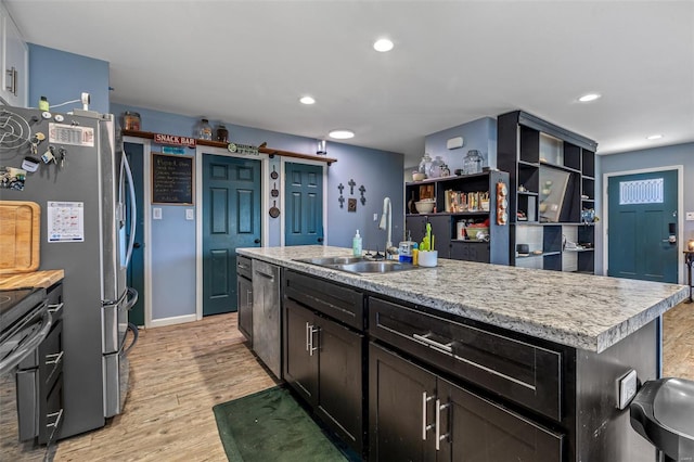 703 Locust St, Desloge, MO 63601 - kitchen featuring a sink, light countertops, light wood-style floors, stainless steel appliances, and recessed lighting