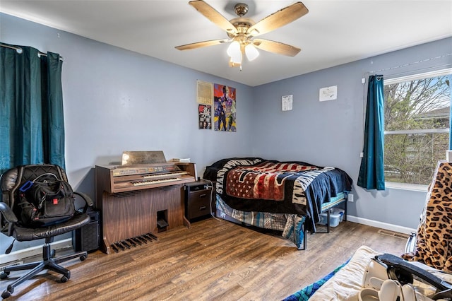 703 Locust St, Desloge, MO 63601 - bedroom featuring wood finished floors, ceiling fan, and baseboards