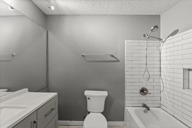 bathroom with a textured ceiling, toilet, vanity, and shower / bathtub combination