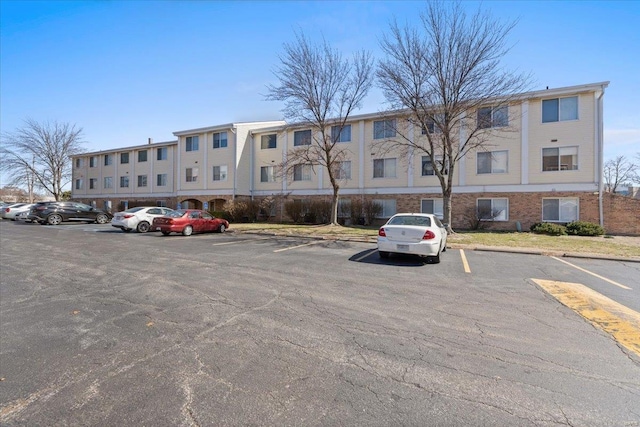 view of property with uncovered parking