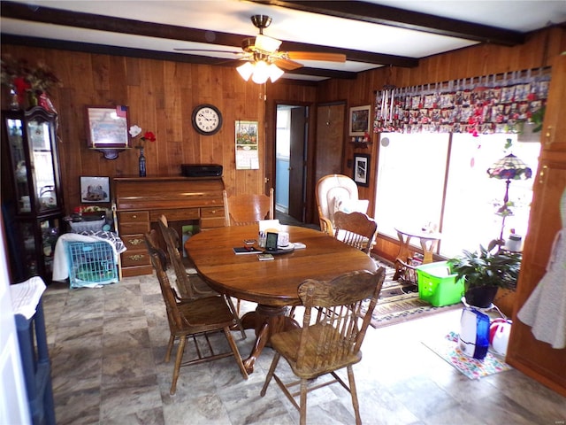 508 N Galloway Rd, Vandalia, MO 63382 - dining area featuring wooden walls, healthy amount of natural light, beamed ceiling, and ceiling fan