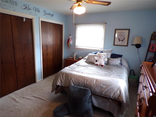508 N Galloway Rd, Vandalia, MO 63382 - carpeted bedroom featuring multiple closets and ceiling fan