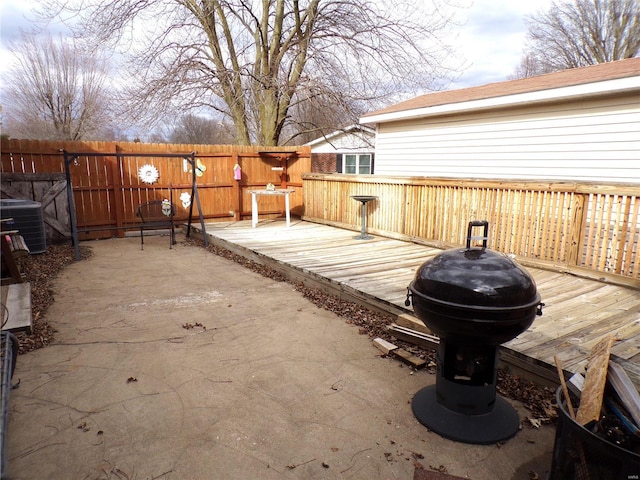 508 N Galloway Rd, Vandalia, MO 63382 - wooden deck featuring fence, central AC unit, grilling area, and a patio