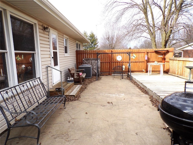 508 N Galloway Rd, Vandalia, MO 63382 - view of patio featuring central air condition unit, fence, and a wooden deck