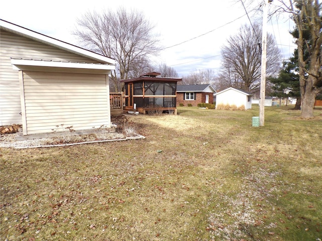 508 N Galloway Rd, Vandalia, MO 63382 - view of grassy yard featuring a sunroom and a deck