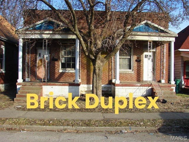 view of front of home featuring brick siding