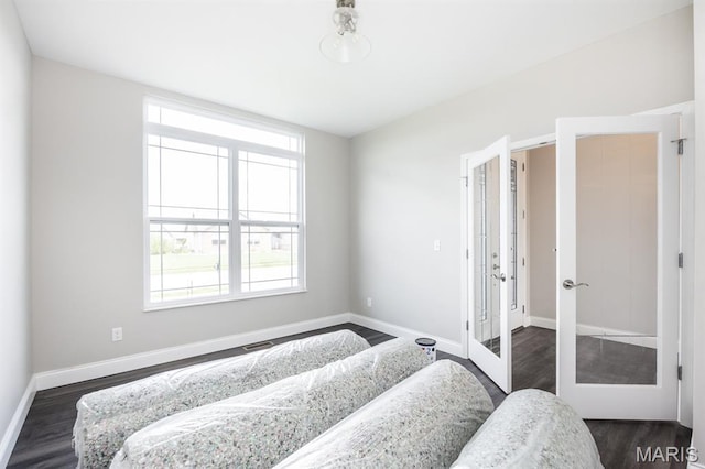 135 Reagan Dr, Troy, IL 62294 - bedroom featuring dark wood-style flooring, baseboards, and french doors