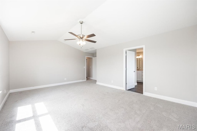 135 Reagan Dr, Troy, IL 62294 - unfurnished bedroom with carpet flooring, baseboards, vaulted ceiling, ceiling fan, and ensuite bath