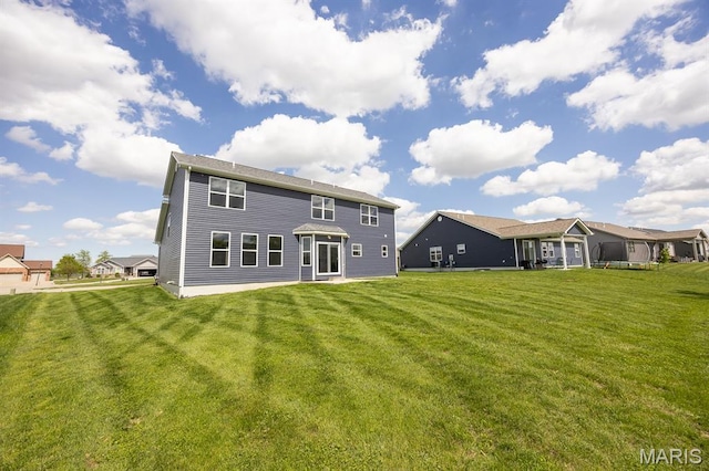 135 Reagan Dr, Troy, IL 62294 - rear view of house with a lawn