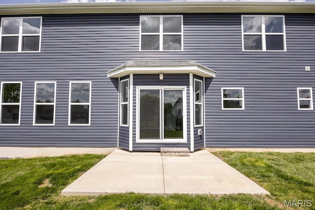 135 Reagan Dr, Troy, IL 62294 - rear view of house with a yard and a patio area