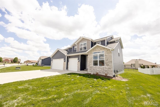 135 Reagan Dr, Troy, IL 62294 - view of front facade featuring stone siding, concrete driveway, and a garage