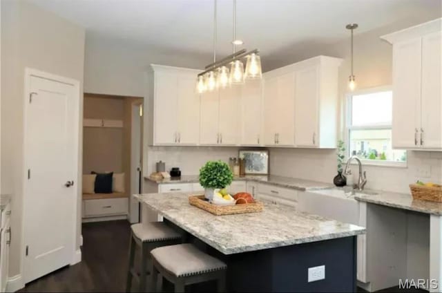 135 Reagan Dr, Troy, IL 62294 - kitchen featuring white cabinets, decorative backsplash, and light stone counters