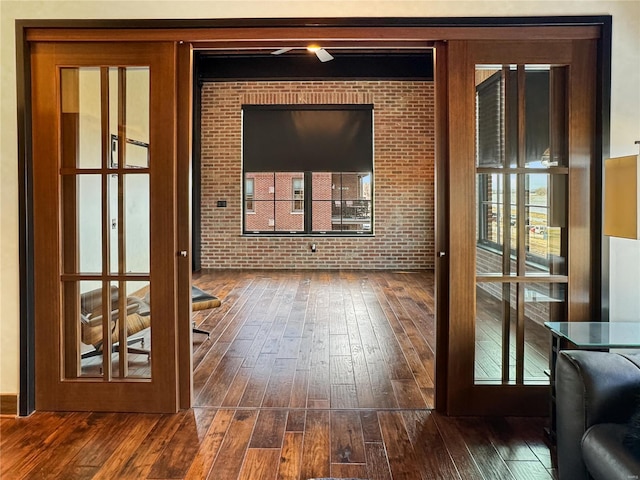 6 E Front St Unit 6, Washington, MO 63090 - doorway to outside with dark wood-style floors and brick wall