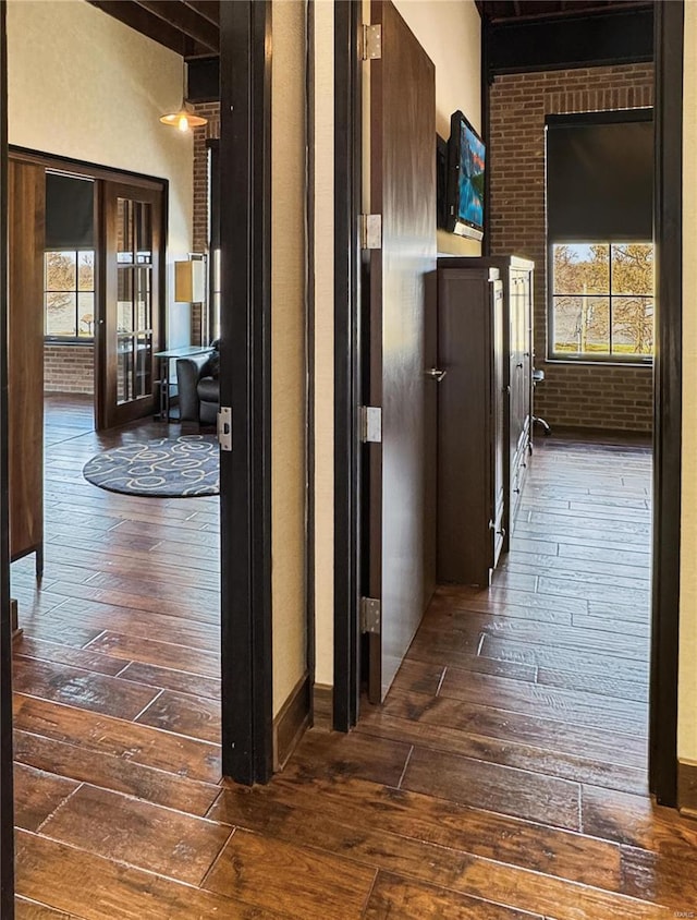 6 E Front St Unit 6, Washington, MO 63090 - hallway featuring dark wood-type flooring, plenty of natural light, and beamed ceiling