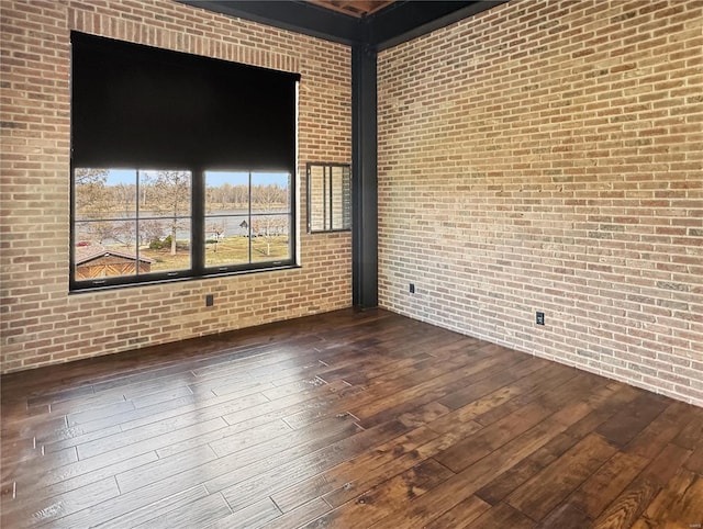 6 E Front St Unit 6, Washington, MO 63090 - spare room with dark wood finished floors and brick wall