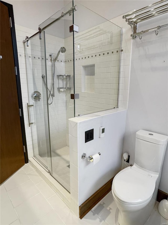 6 E Front St Unit 6, Washington, MO 63090 - bathroom with a stall shower, toilet, and tile patterned floors