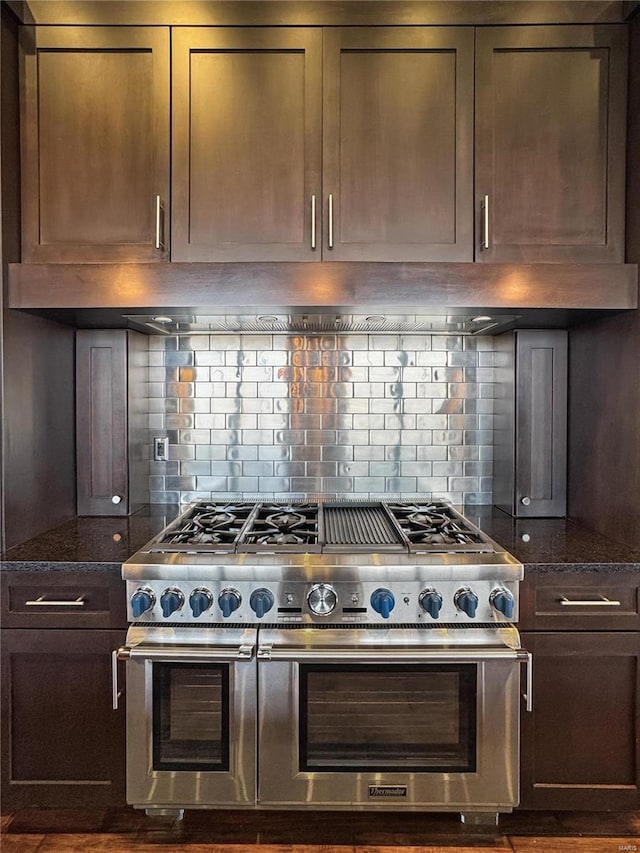 6 E Front St Unit 6, Washington, MO 63090 - kitchen featuring double oven range, backsplash, and dark stone countertops