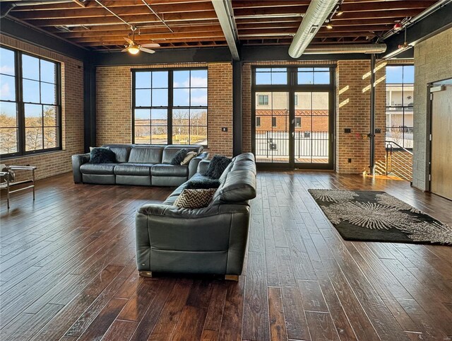 6 E Front St Unit 6, Washington, MO 63090 - living room featuring brick wall, wood-type flooring, ceiling fan, and beamed ceiling