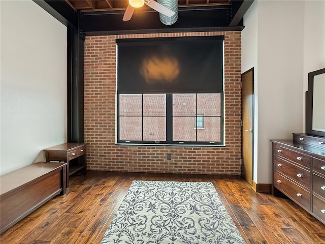 6 E Front St Unit 6, Washington, MO 63090 - bedroom with dark wood-style floors and brick wall