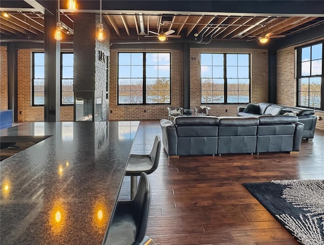 6 E Front St Unit 6, Washington, MO 63090 - living room with brick wall and wood-type flooring