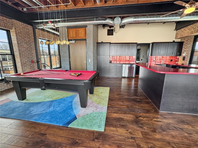 6 E Front St Unit 6, Washington, MO 63090 - rec room with brick wall, dark wood-type flooring, healthy amount of natural light, billiards table, and a towering ceiling
