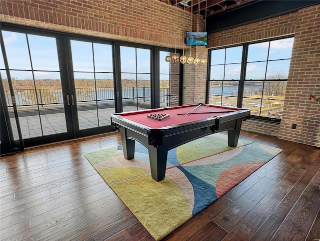 6 E Front St Unit 6, Washington, MO 63090 - playroom with brick wall, a towering ceiling, hardwood / wood-style flooring, billiards table, and french doors