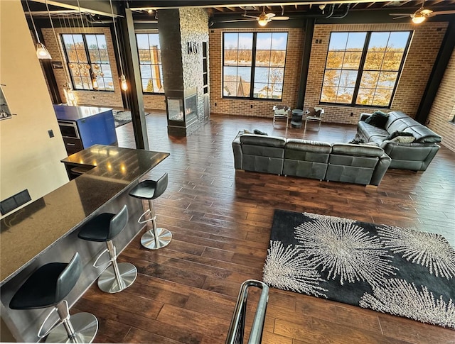 6 E Front St Unit 6, Washington, MO 63090 - living room featuring brick wall and hardwood / wood-style flooring