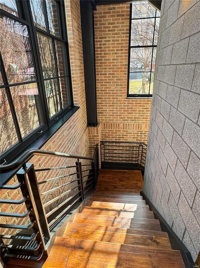 6 E Front St Unit 6, Washington, MO 63090 - stairway with hardwood / wood-style floors and brick wall