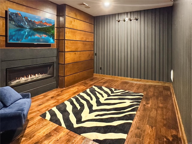 6 E Front St Unit 6, Washington, MO 63090 - sitting room with hardwood / wood-style flooring, baseboards, and a warm lit fireplace