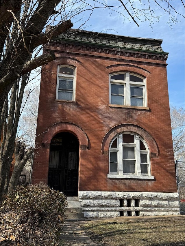 second empire-style home with brick siding