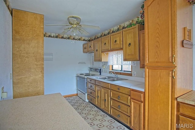 1153 Red Fox Rd, Camdenton, MO 65324 - kitchen featuring white electric stove, a sink, light countertops, and ceiling fan