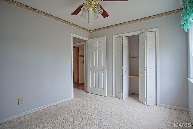 1153 Red Fox Rd, Camdenton, MO 65324 - unfurnished bedroom with baseboards, light colored carpet, a closet, and a ceiling fan