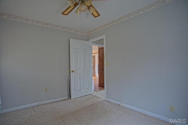 1153 Red Fox Rd, Camdenton, MO 65324 - spare room with light colored carpet, a ceiling fan, and baseboards