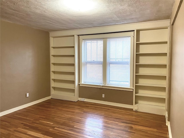 5727 Dewey Ave, Saint Louis, MO 63116 - unfurnished room with a textured ceiling, dark wood-style floors, baseboards, and built in features