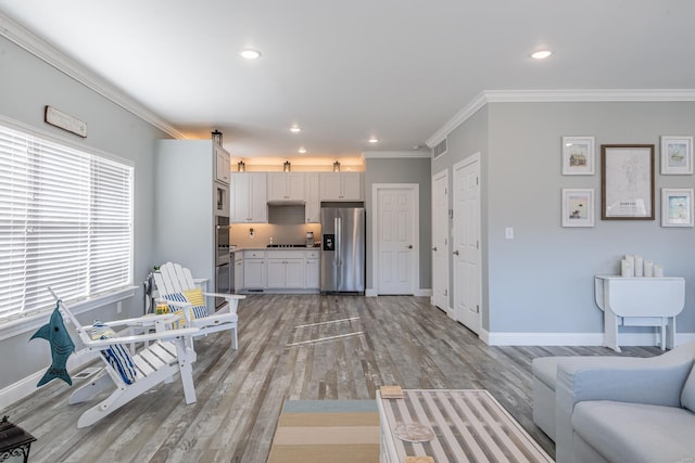 24345 State Rte Ww Unit 46, Saint Genevieve, MO 63670 - living area with crown molding, light wood-style floors, baseboards, and recessed lighting
