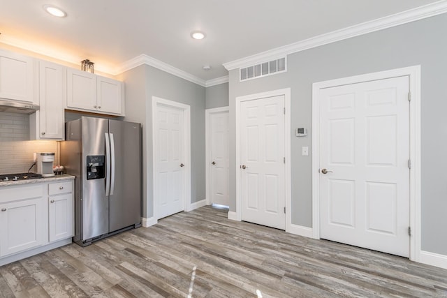 24345 State Rte Ww Unit 46, Saint Genevieve, MO 63670 - kitchen featuring stainless steel fridge with ice dispenser, light wood-style floors, ornamental molding, decorative backsplash, and baseboards
