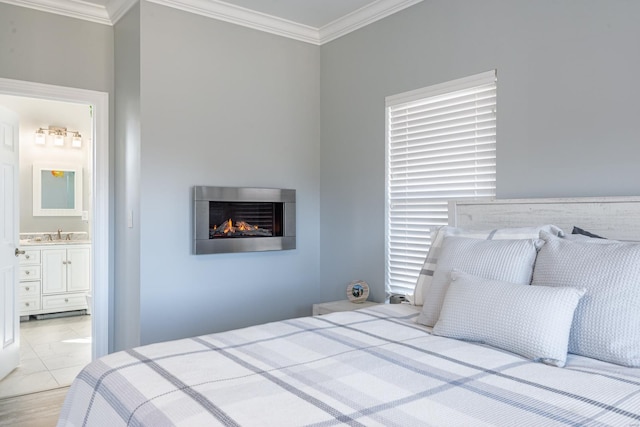 24345 State Rte Ww Unit 46, Saint Genevieve, MO 63670 - bedroom featuring crown molding, a warm lit fireplace, a sink, and ensuite bath