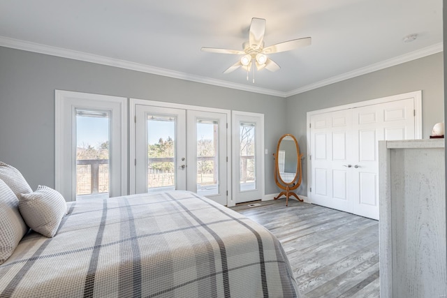 24345 State Rte Ww Unit 46, Saint Genevieve, MO 63670 - bedroom with french doors, access to outside, light wood finished floors, multiple windows, and crown molding
