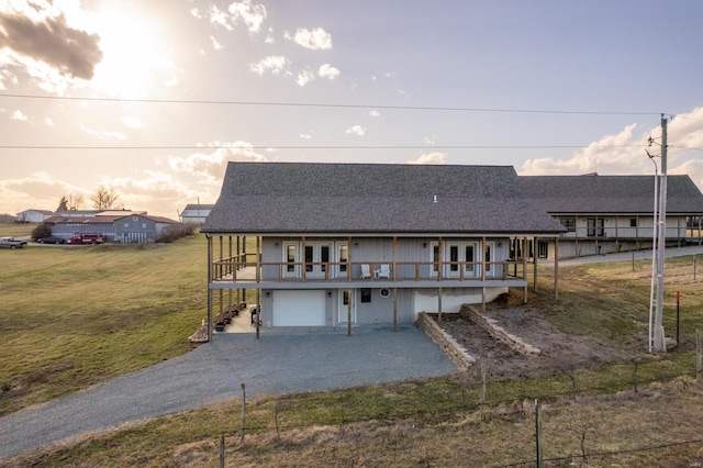 24345 State Rte Ww Unit 46, Saint Genevieve, MO 63670 - view of front of property featuring an attached garage, driveway, french doors, and a wooden deck