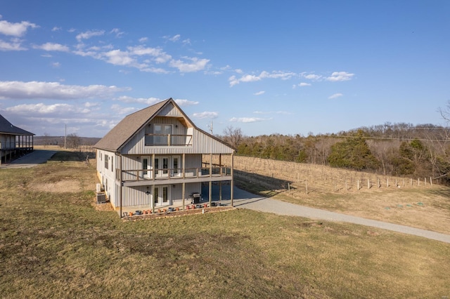 24345 State Rte Ww Unit 46, Saint Genevieve, MO 63670 - rear view of property with a lawn, a patio area, and a wooden deck