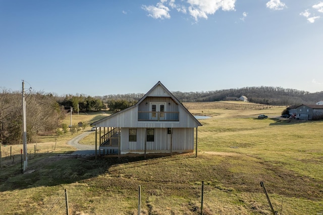 24345 State Rte Ww Unit 46, Saint Genevieve, MO 63670 - rear view of house featuring stairway, a yard, and a view of countryside