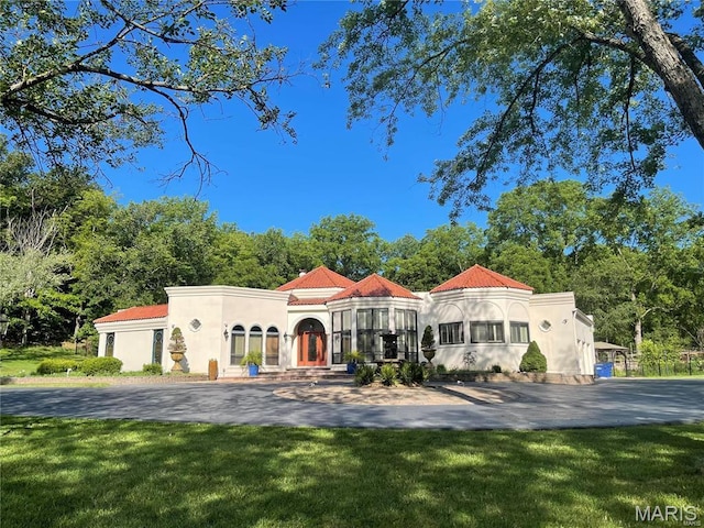 651 Kiefer Creek Rd, Ballwin, MO 63021 - mediterranean / spanish-style house with stucco siding and a front yard