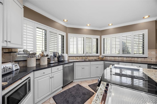 651 Kiefer Creek Rd, Ballwin, MO 63021 - kitchen featuring a sink, appliances with stainless steel finishes, tasteful backsplash, recessed lighting, and ornamental molding