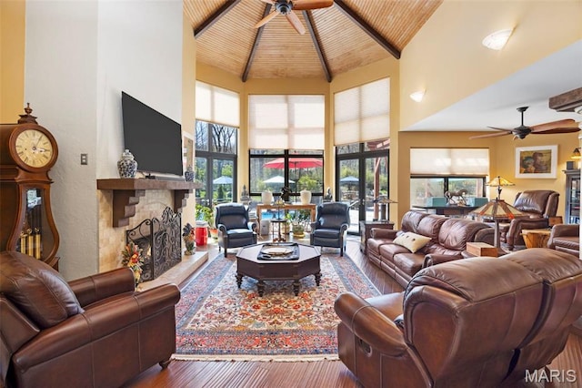 651 Kiefer Creek Rd, Ballwin, MO 63021 - living room featuring a ceiling fan, high vaulted ceiling, a stone fireplace, wood-type flooring, and wood ceiling
