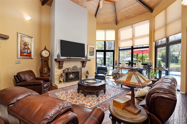 651 Kiefer Creek Rd, Ballwin, MO 63021 - living area with high vaulted ceiling, a fireplace, wood finished floors, a ceiling fan, and plenty of natural light
