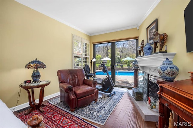 651 Kiefer Creek Rd, Ballwin, MO 63021 - living area with crown molding, wood finished floors, french doors, baseboards, and a fireplace