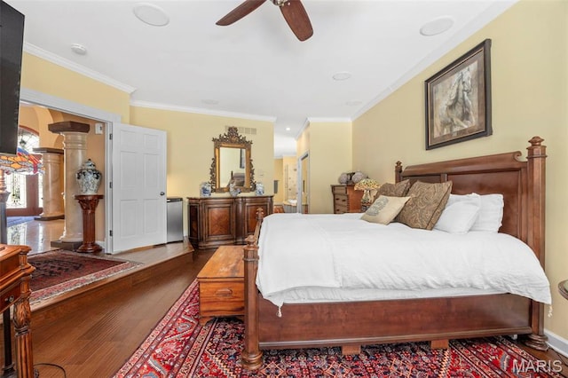 651 Kiefer Creek Rd, Ballwin, MO 63021 - bedroom featuring wood finished floors, ornamental molding, a ceiling fan, and decorative columns