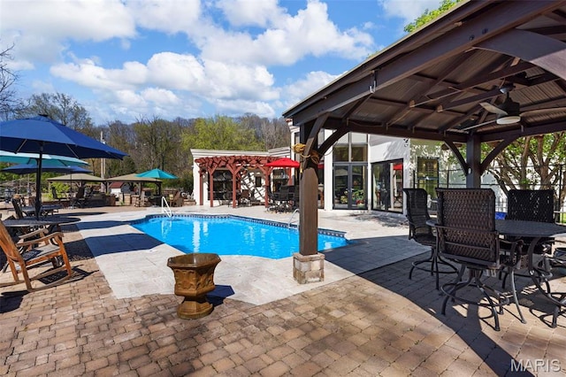 651 Kiefer Creek Rd, Ballwin, MO 63021 - swimming pool featuring a gazebo, ceiling fan, a patio, and outdoor dining area