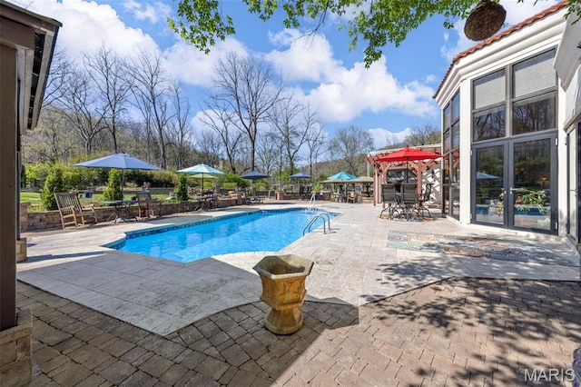 651 Kiefer Creek Rd, Ballwin, MO 63021 - view of swimming pool with a patio, outdoor dining space, and french doors