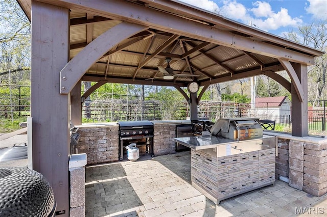 651 Kiefer Creek Rd, Ballwin, MO 63021 - view of patio / terrace featuring exterior kitchen, a gazebo, fence, and a grill